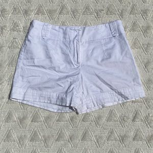 White House Black House white shorts.